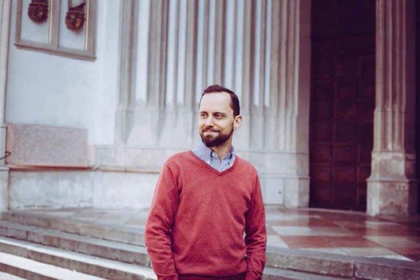 man in front of a church