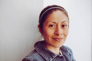 Portrait of a woman in front of a white background