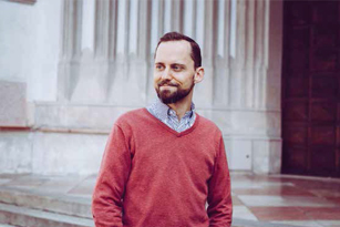 man in front of a church